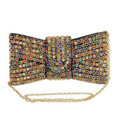 Multicolored beaded clutch bag with a gold chain on a white surface