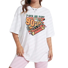 Woman wearing a white t-shirt with 'Take me back to the 90s' design in front of a white wall.